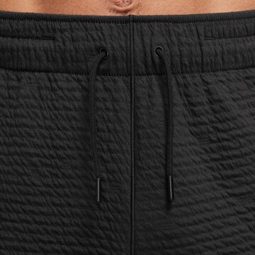 NIKE Regular Sports trousers in Black