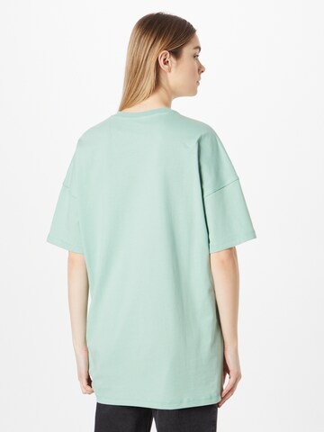 new balance - Camisa oversized em verde