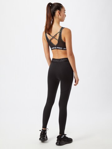 NIKE Skinny Sporthose in Schwarz