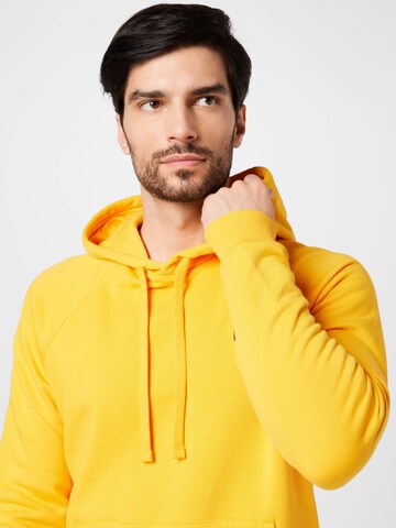 UNDER ARMOUR Regular Fit Sportsweatshirt 'Rival' in Orange