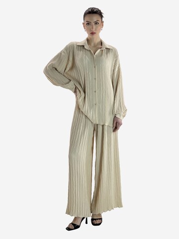 Elara Buksedragt i beige: forside