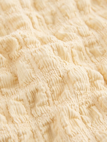 Top de la Next pe galben