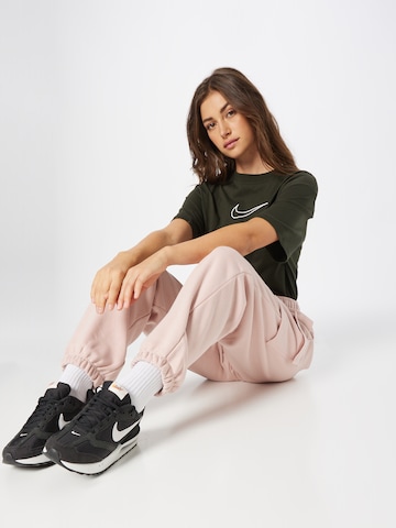Nike Sportswear - Tapered Calças cargo em rosa