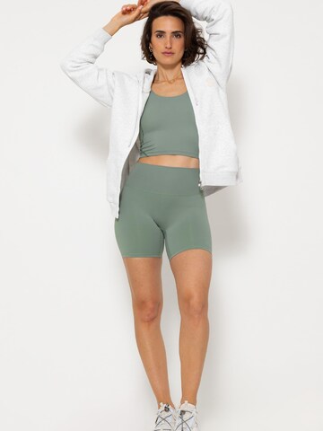 SASSYCLASSY Skinny Leggings‌‌ in Grün: Vorderseite