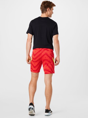 NIKE Regular Sportbroek in Rood