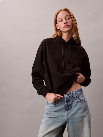 Sweat-shirt Calvin Klein en noir : devant