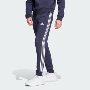 mėlyna ADIDAS SPORTSWEAR Siaurėjantis Sportinės kelnės 'Essentials'