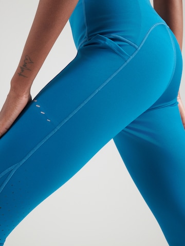 NIKE Kitsas Spordipüksid 'SWIFT', värv sinine