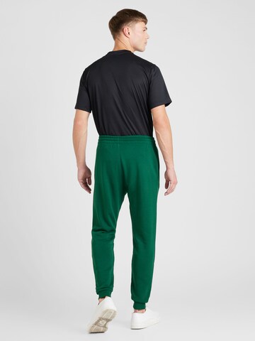 Tapered Pantaloni 'IDENTITY' de la Reebok pe verde