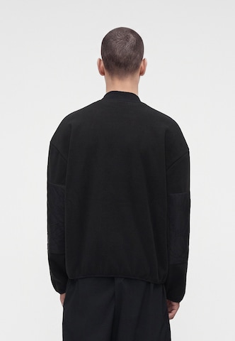 Veste en polaire Champion en noir : derrière