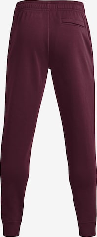 Effilé Pantalon de sport 'Rival' UNDER ARMOUR en rouge