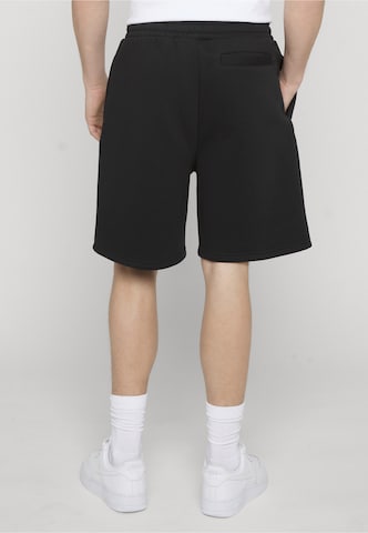 Karl Kani Regular Trousers in Black