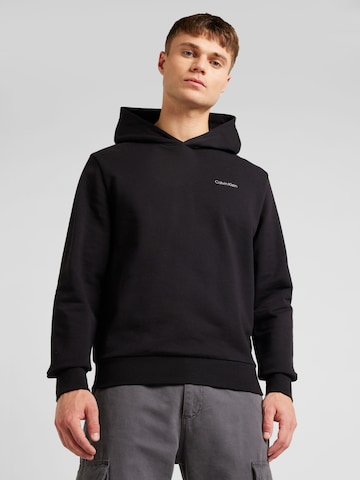 Sweat-shirt Calvin Klein en noir : devant