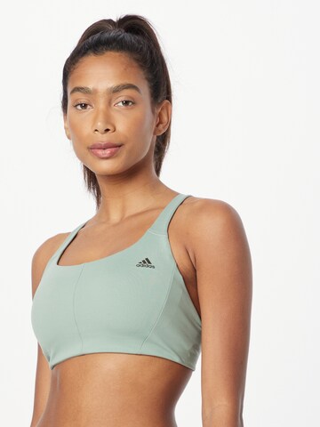 ADIDAS SPORTSWEAR - Soutien Bustier Soutien de desporto 'Coreflow Medium-Support' em verde: frente