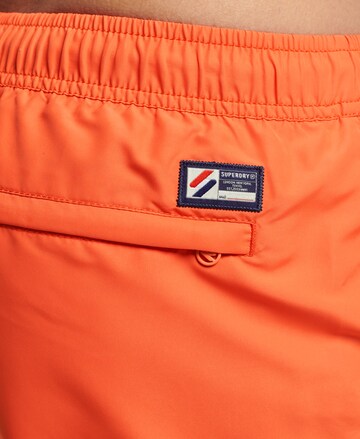 Superdry Plavecké šortky – oranžová