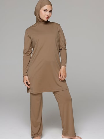 SIYA Swimwear Swimsuit 'South - Covered' in Brown: front