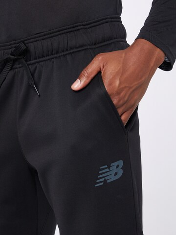 Effilé Pantalon de sport 'Tenacity' new balance en noir