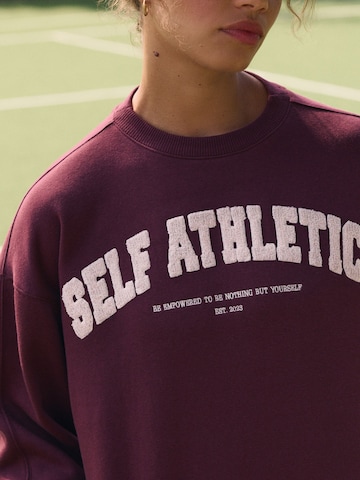 Sweat-shirt self. en rouge