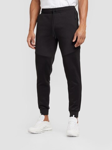 PUMA Tapered Trousers in Black: front