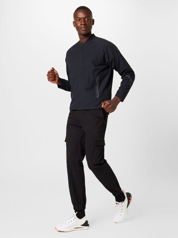 UNDER ARMOUR Sportsjakke 'Unstoppable' i sort