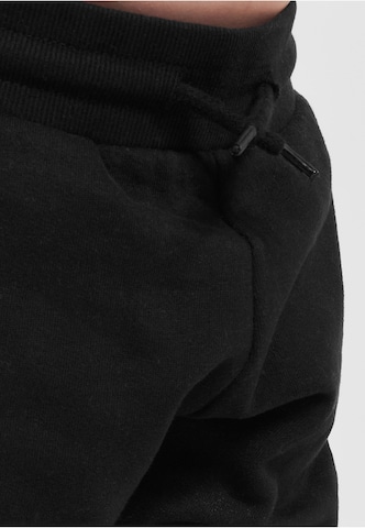 Tapered Pantaloni di Urban Classics in nero