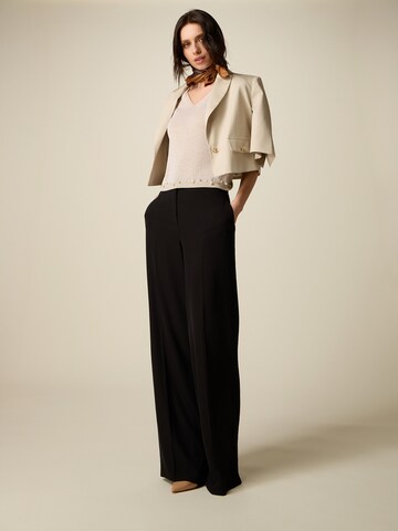 oltre Baggy Trousers in Black: front