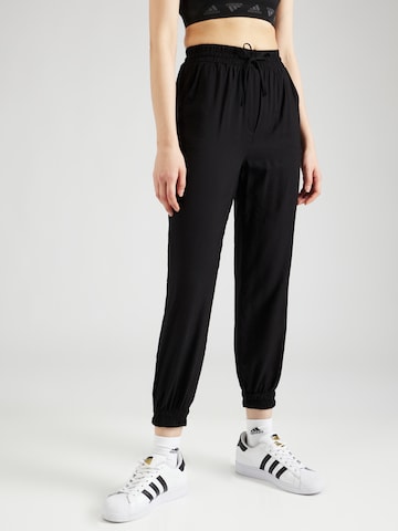 Trendyol Tapered Trousers in Black: front