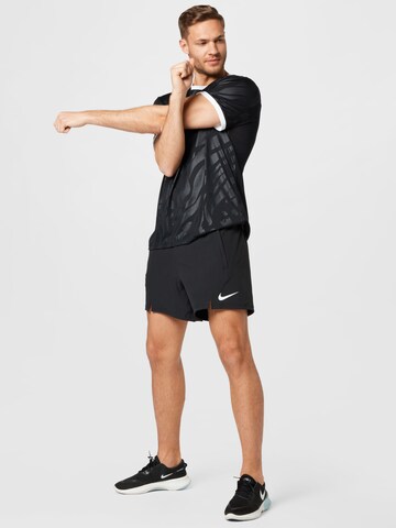 Regular Pantaloni sport de la NIKE pe negru