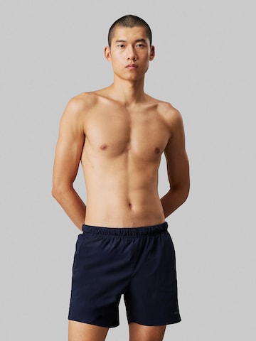 Calvin Klein Swimwear Board Shorts in Blue: front