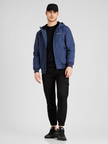 Carhartt WIP Regular fit Tussenjas 'Sail' in Blauw