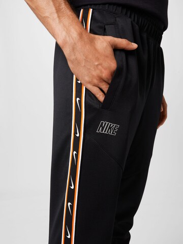 Effilé Pantalon Nike Sportswear en noir