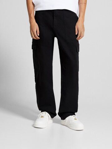 Loosefit Pantalon cargo Bershka en noir : devant