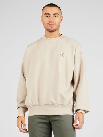 Sweat-shirt Calvin Klein Jeans en beige : devant