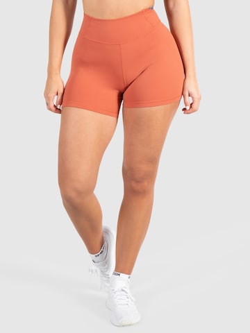 Smilodox Skinny Workout Pants 'Advance Pro' in Orange: front