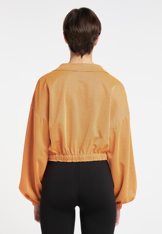 regular Pantaloni cargo di myMo ATHLSR in arancione