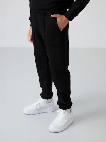 Tommy Life Trainingspak 'TOMMY Kinder Active Set' in Zwart
