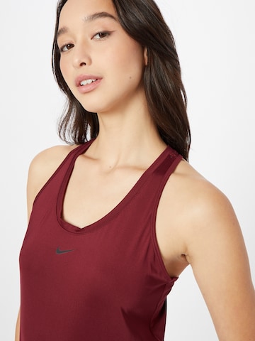 NIKE Športni top | rdeča barva