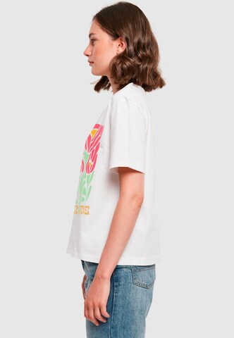 T-shirt 'Flower Power' Merchcode en blanc