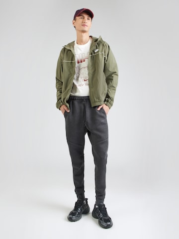 Nike Sportswear Tapered Hose 'TCH FLC' in Grau