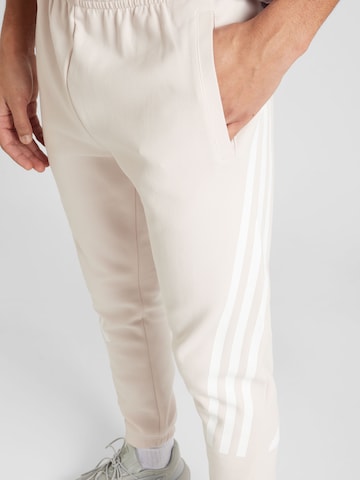 Effilé Pantalon de sport 'Future Icons' ADIDAS SPORTSWEAR en beige