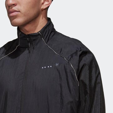 ADIDAS ORIGINALS Übergangsjacke 'Reveal Material Mix' in Schwarz