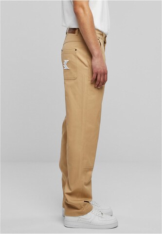 Karl Kani Regular Trousers in Beige
