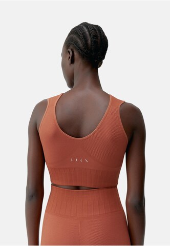Born Living Yoga Top 'Annapurna' in Orange