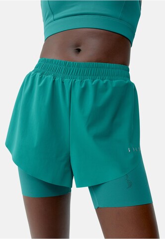 Born Living Yoga Skinny Sports trousers 'Bikila' in Green: front