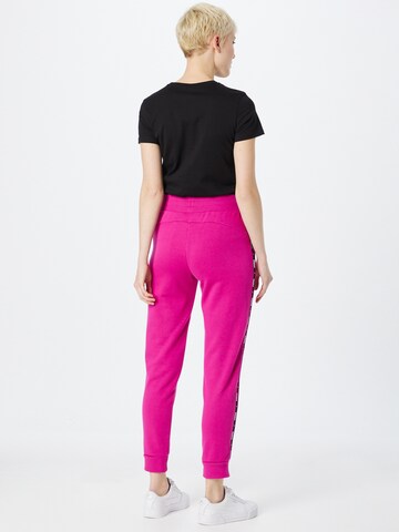 PUMA - Tapered Pantalón deportivo en rosa