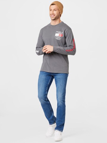 T-Shirt 'Globe' Tommy Jeans en gris