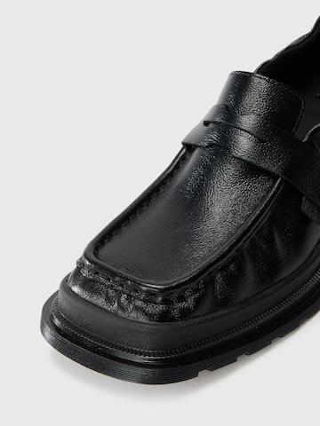 Papuci de casă 'Maybole' de la Dr. Martens pe negru