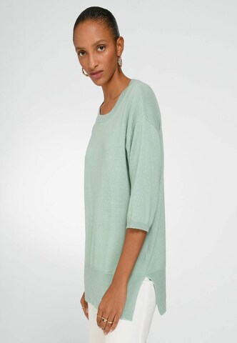 Pull-over include en vert