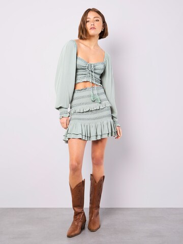 Haut Apricot en vert