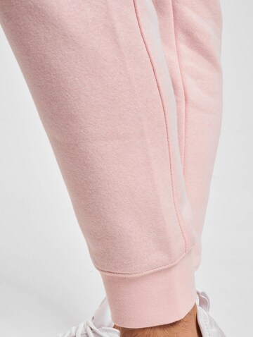 Nike Sportswear Tapered Hose 'Club Fleece' in Pink